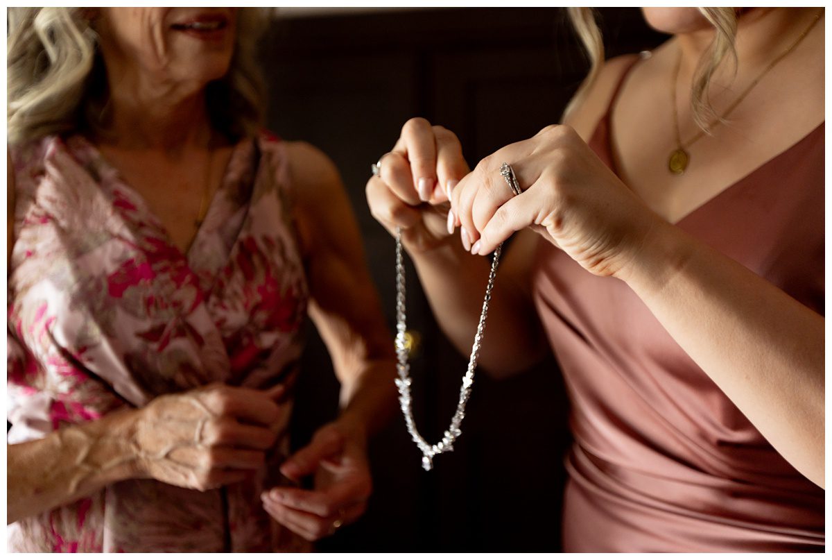 getting necklace ready for bride