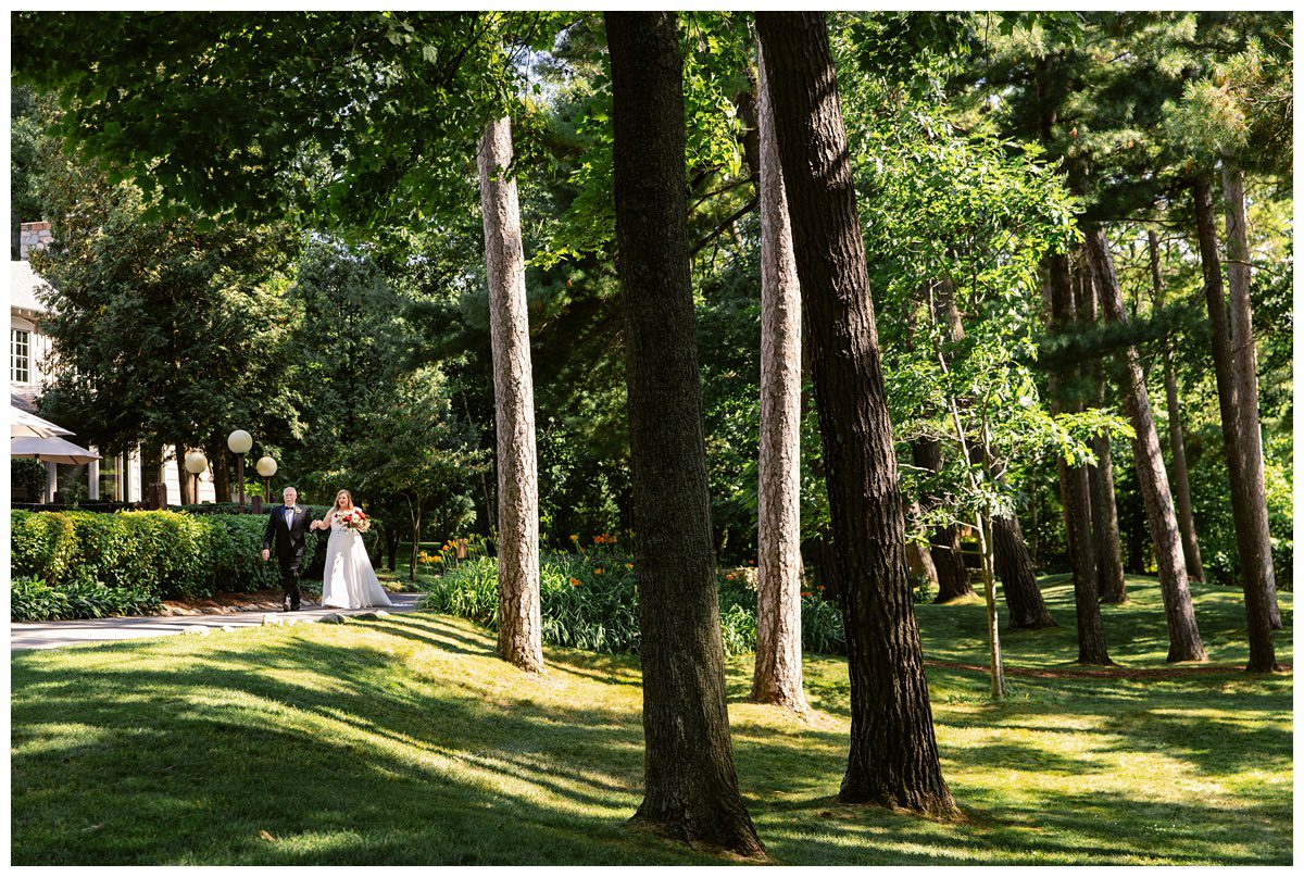 bride walking to groom at mission table