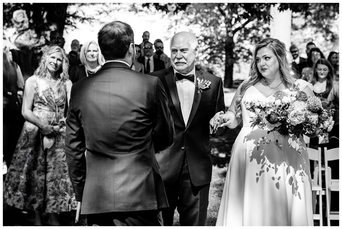 father giving away daughter to groom