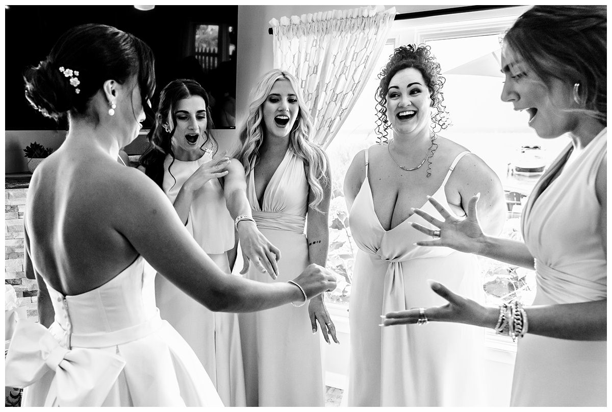 bridesmaids seeing the diamond tennis bracelet gift