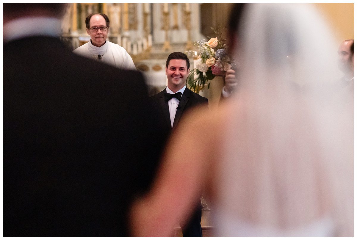 groom seeing his bride walk down the aisle to him