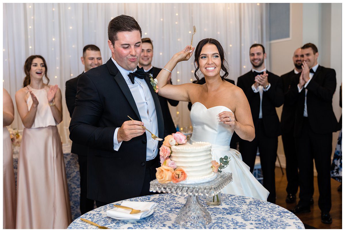 cutting the wedding cake at the Charlevoix Yacht Club
