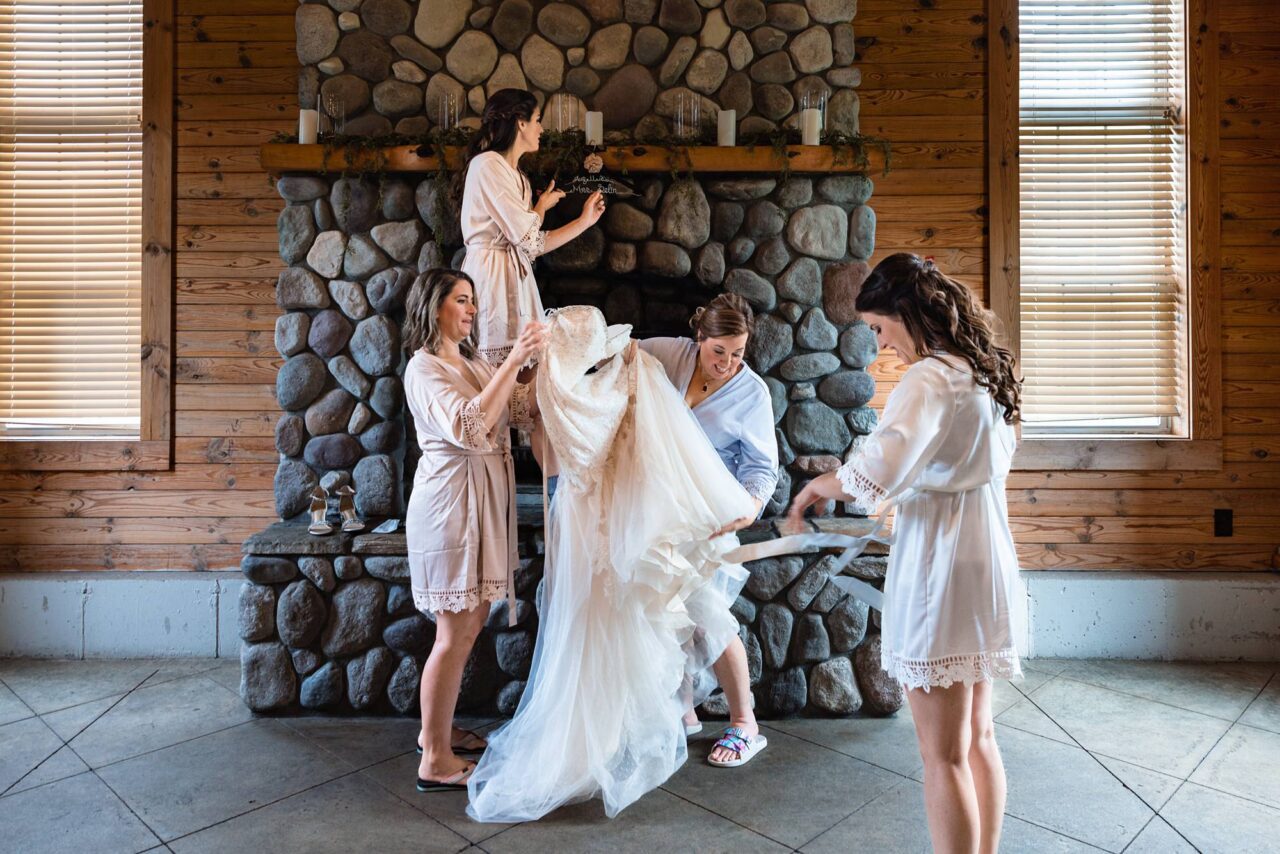 bride getting dressed at caberfae peaks