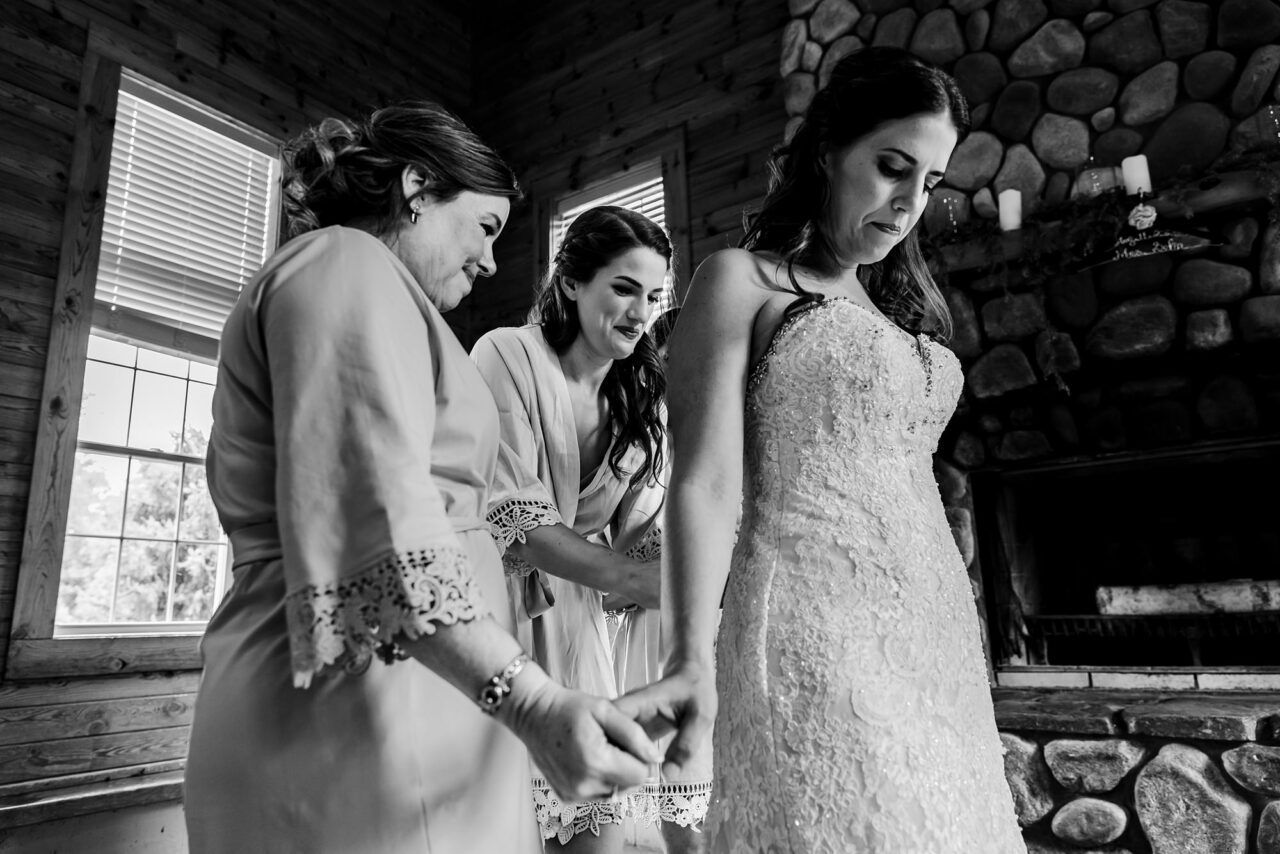 bride getting dressed at caberfae peaks