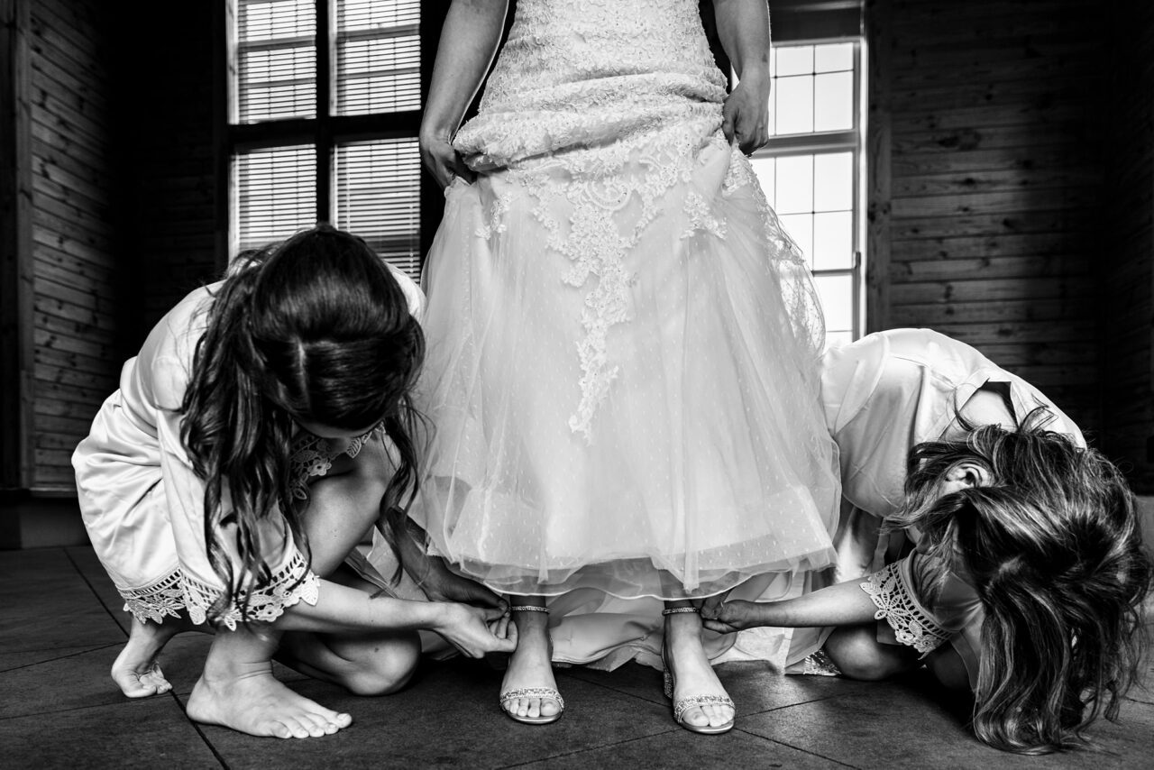 bride getting dressed at caberfae peaks