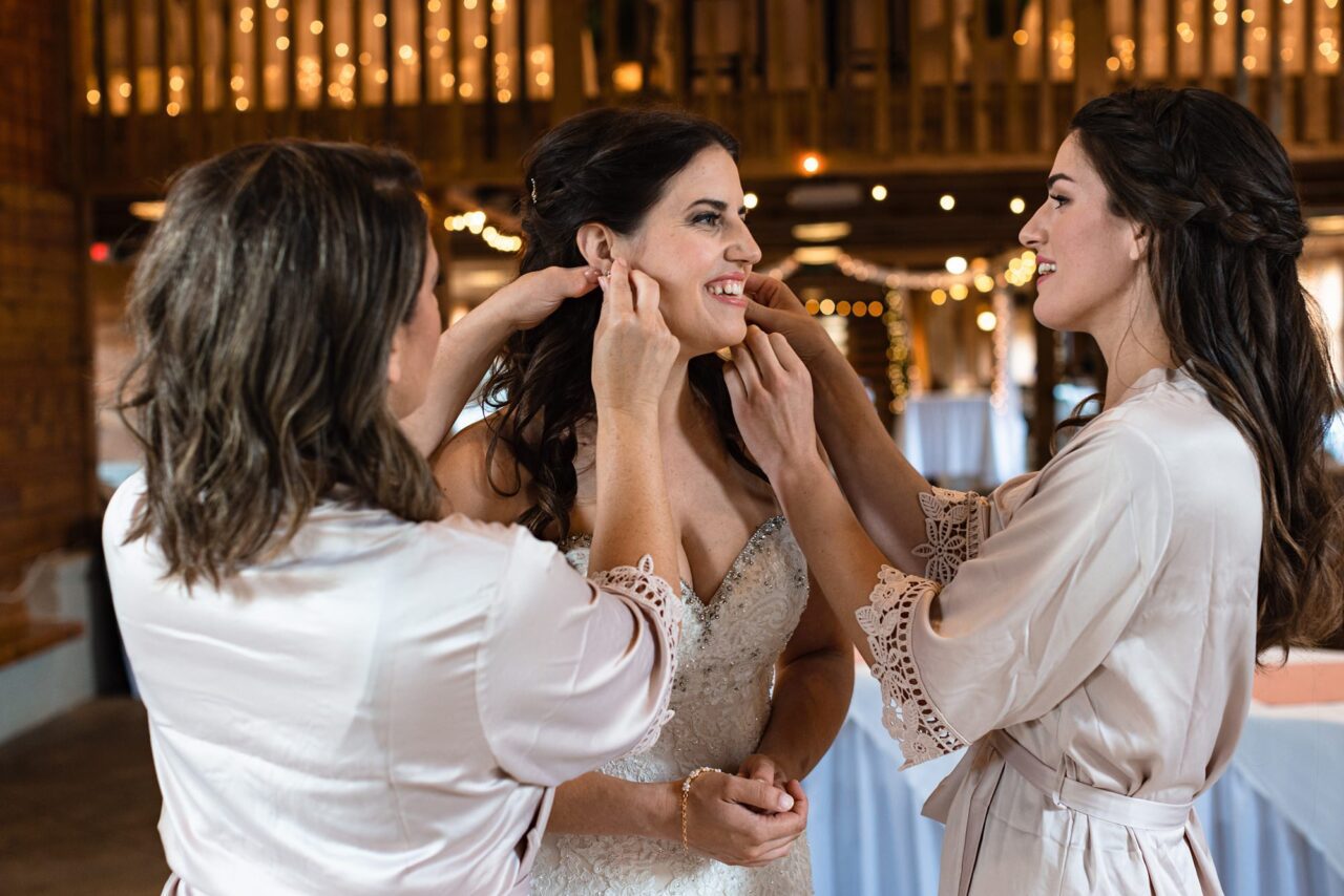 bride getting dressed at caberfae peaks