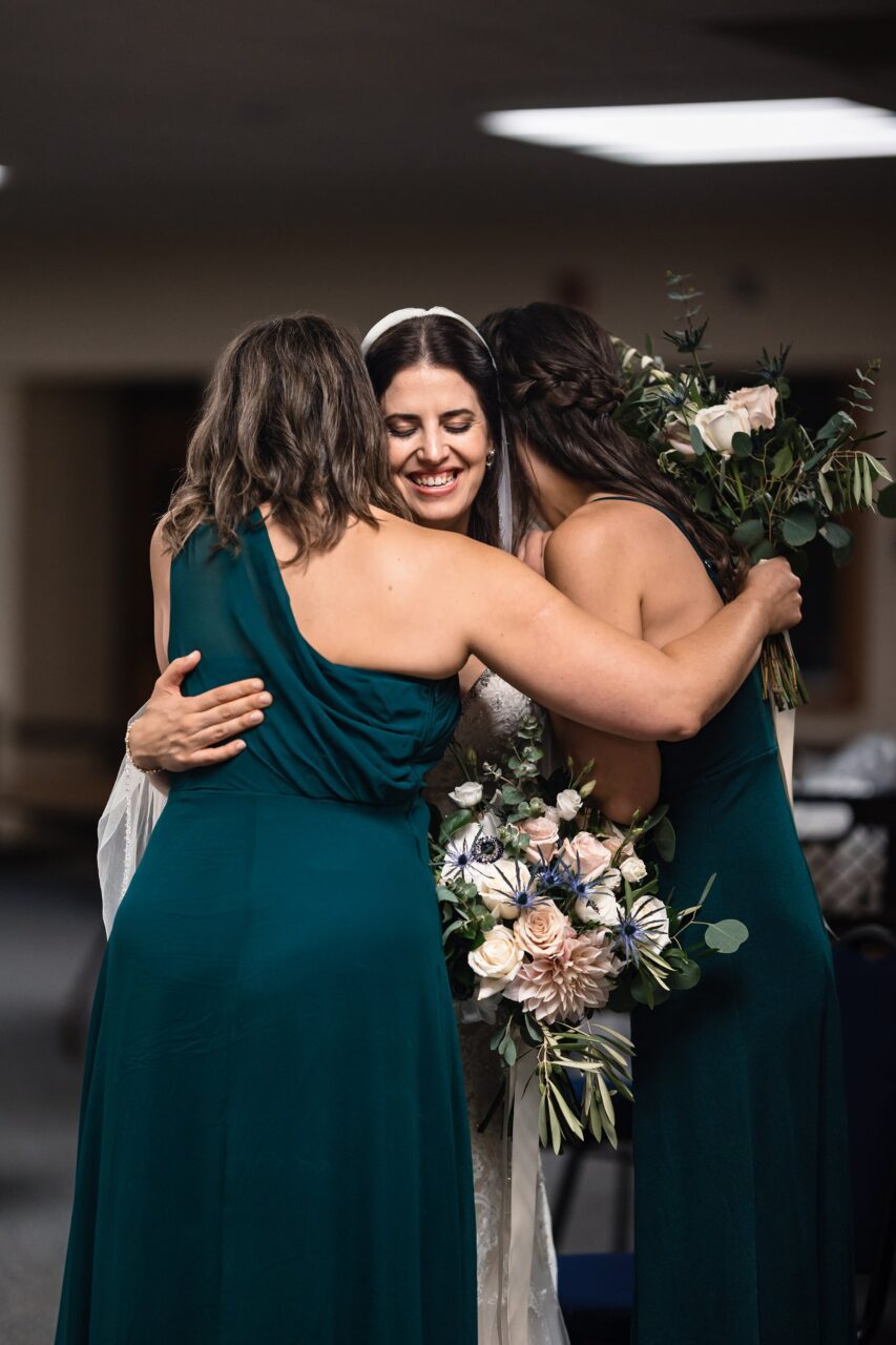 bride and her sisters just before the wedding