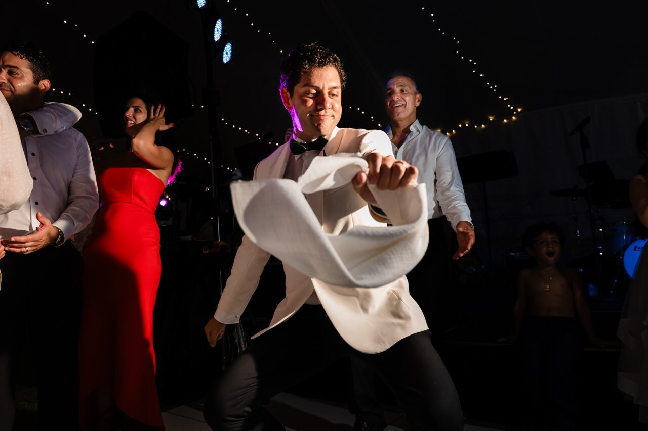 Groom dancing at wedding reception at Bay Harbor Michigan