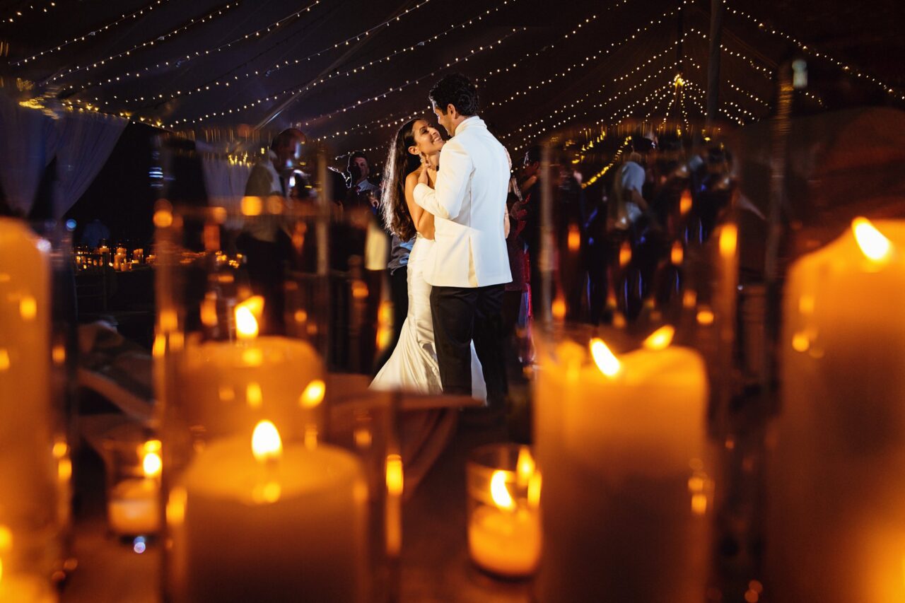 A BAY HARBOR MARINA WEDDING Paper Hat Wedding Planners candle lit reception design at Bay Harbor Marina