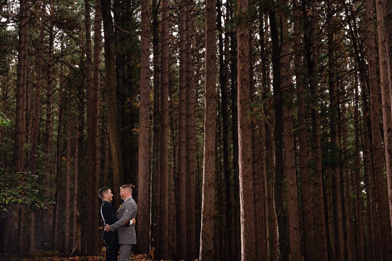 grooms in the pines in Glen Arbor at wedding
