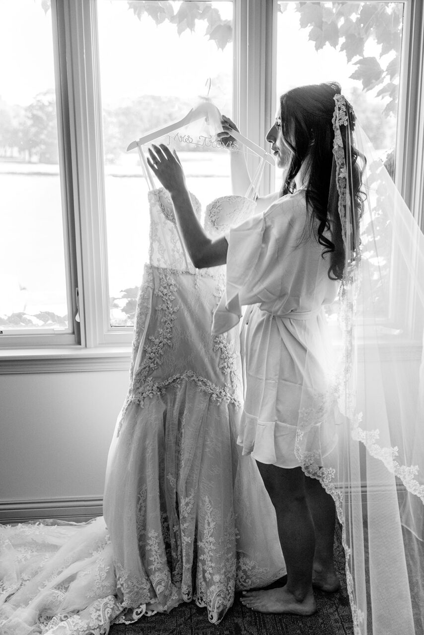 Bride getting dress ready to wear